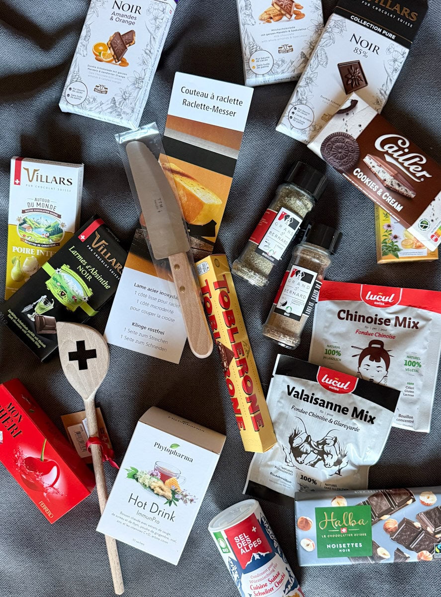multiples achats en suisse: chocolat, outil à raclette, fondue, etc